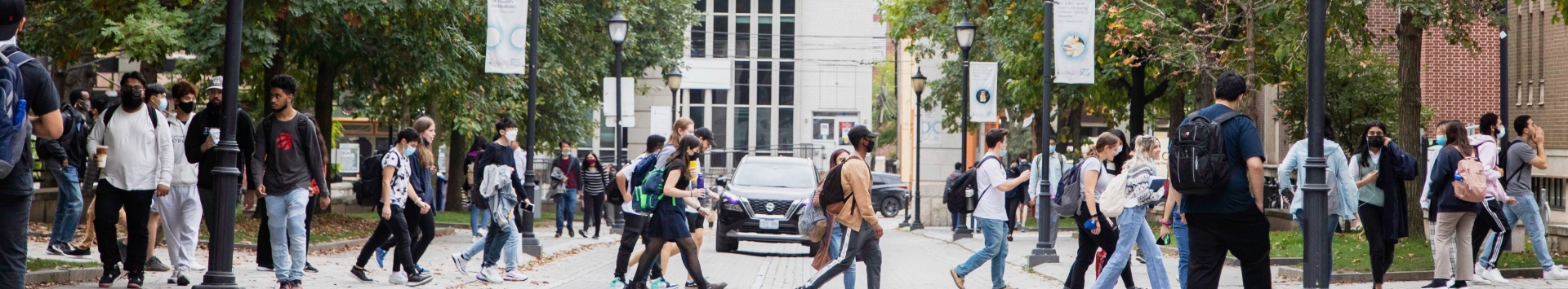 A group of students crossing the road